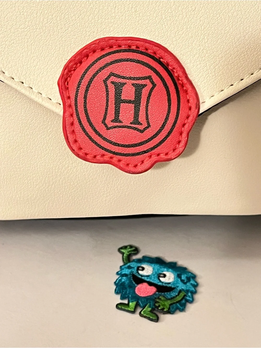 Hogwarts Acceptance Letter Backpack with Red Pom Charm Zipper Pull